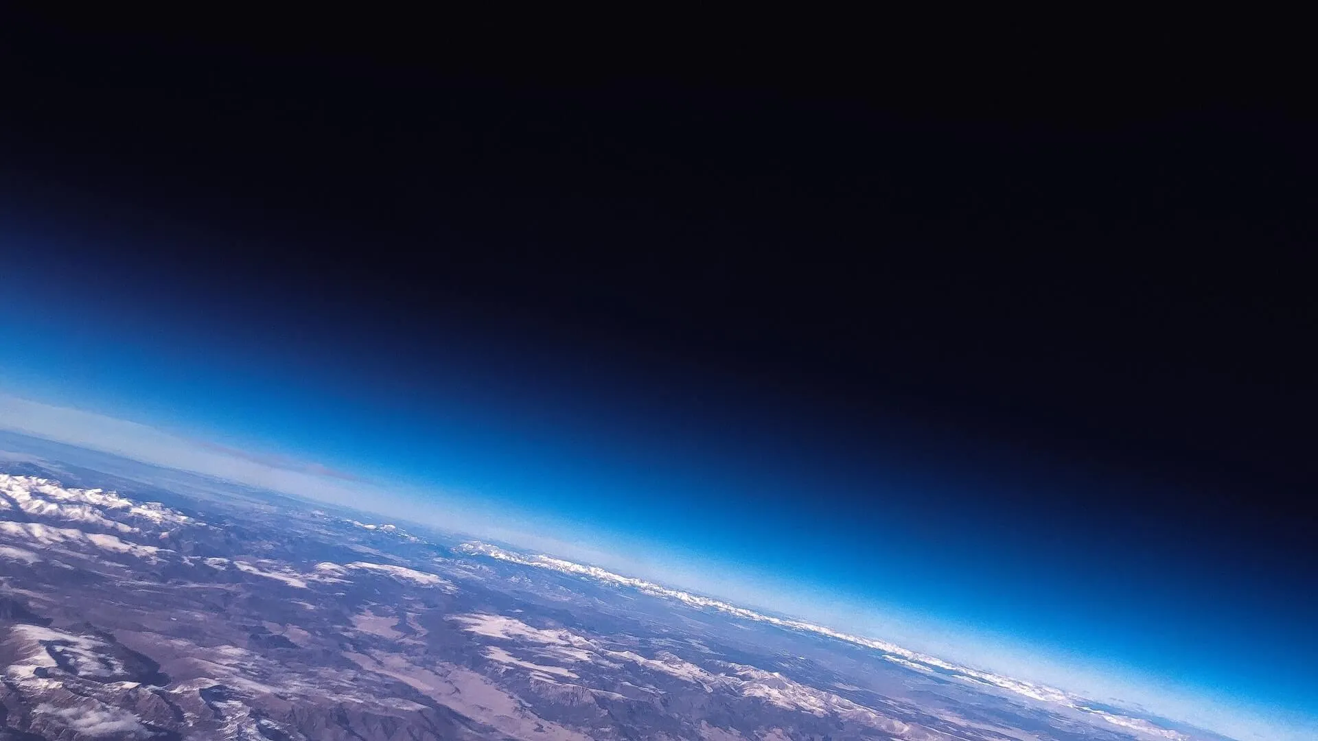 Photo of the Earth's horizon and space from the lower Earth orbit